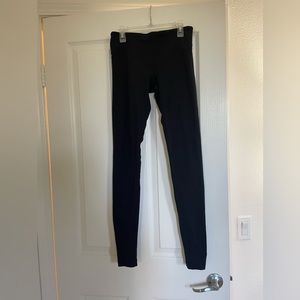 Full length black leggings.